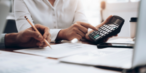 accountants using a calculator